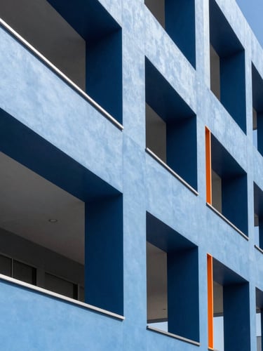 Architectural detail of a modern office interior, focusing on clean lines and a structured collaborative zone, bright natural daylight, crisp corporate blue, high-contrast, 35mm.