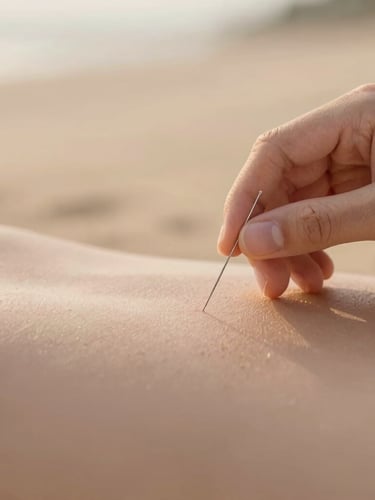 Close-up of a hand placing a single delicate acupuncture needle on a relaxed shoulder, soft golden-hour light, warm sand background, shallow depth of field
