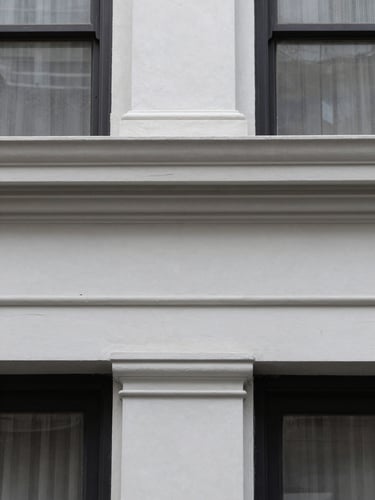 Close-up of clean architectural molding in a renovated historic Brooklyn brownstone, natural overcast light
