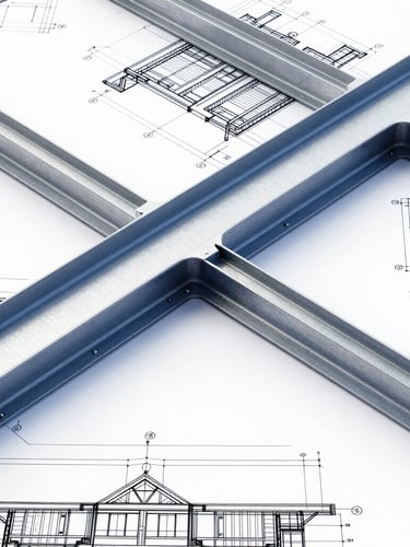 A crisp, high-contrast overhead shot of a technical structural drawing, showing detailed steel beam connections, architectural elevations, blueprint overlays, steel blue and white tones.