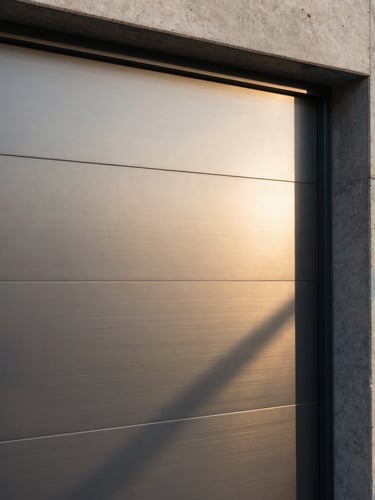 Extreme close-up of a sleek, minimalist brushed steel security gate integrated into a modern concrete wall, sharp geometric shadows, soft warm lighting reflecting on metallic surfaces.