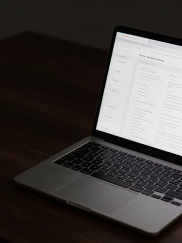 A close-up shot of a sleek laptop screen displaying a clean research interface with data visualizations, soft glowing light casting onto a dark wooden desk, minimalist aesthetic.
