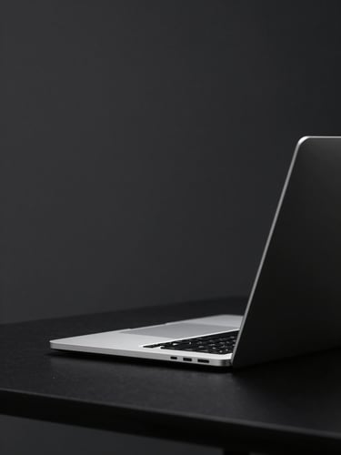 Minimalist dark-mode digital photography of a clean digital workspace, glowing laptop screen, soft localized glowing light, deep charcoal and silver tones, shallow depth of field
