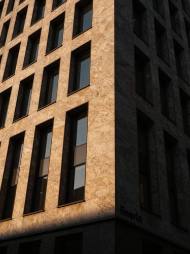 Dramatic architectural angle of the Fingerclic Building facade, sharp shadows, golden-hour light hitting warm travertine stone, wide-angle lens, 35mm