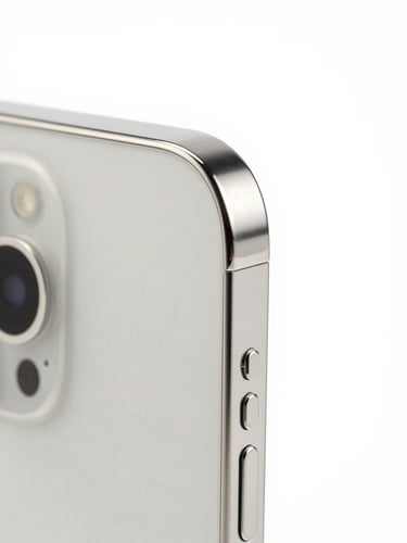 Pristine smartphone hardware close-up, bright high-key studio lighting, neutral minimalist tones, sharp macro lens focusing on the titanium edge and camera ring, isolated profile.