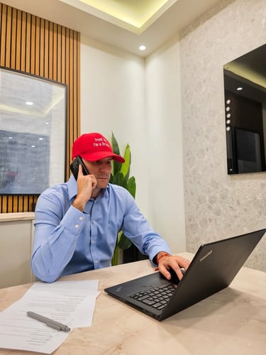 Adam Day, independent Dubai property advisor, speaking with a client on the phone
