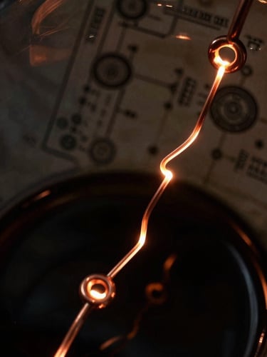 Extreme close-up of dark archival laboratory glassware with glowing copper electrochemical loops, deep obsidian shadows, technical schematics in background, low-key dramatic lighting, macro photography