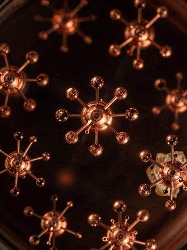 Macro shot of liquid crystal arrays under copper light, abstract high-spin atomic structures, dark alchemical photography, dramatic low-key copper lighting, deep obsidian and warm parchment tones, macro lens, high contrast, archival scientific aesthetic