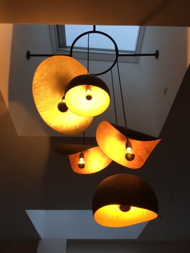 a couple of lamps hanging from a ceiling