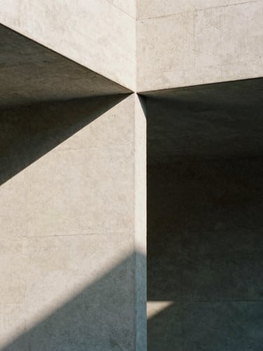 Abstract close-up of sharp architectural concrete lines and geometric shadows, high-contrast daylight, serene editorial mood, 35mm film.