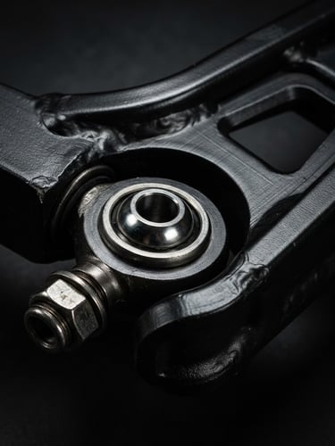 Extreme close-up of a heavy-duty black anodized steel suspension arm, dramatic studio lighting, metallic reflections, sharp focus