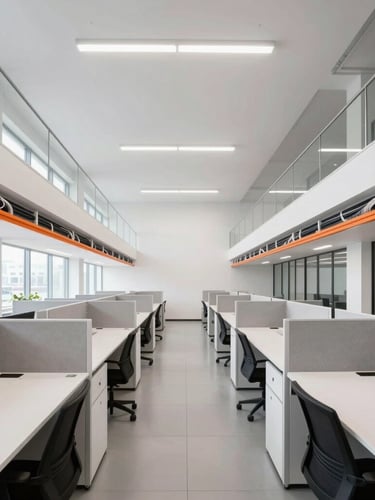 Symmetrical architectural shot of a bright, modern corporate office with clean desk lines, structured cabling channels, and high-contrast daylighting.