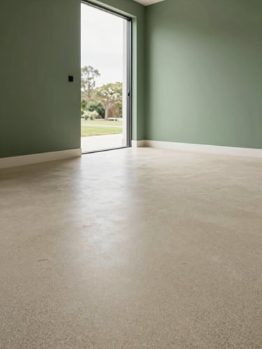Low-angle architectural photograph of a residential garage with a flawless, dust-free grey epoxy flake floor, soft natural overcast daylight pouring through the open door, Scandinavian style, minimalist clean interior