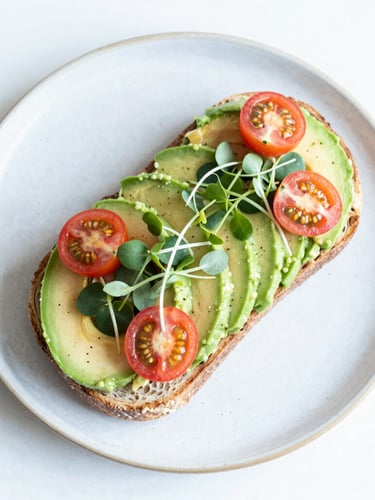 Overhead flat-lay of a vibrant and colorful avocado toast with fresh cherry tomatoes and microgreens on a rustic plate, bright high-key natural daylight, saturated mint and coral tones, shallow depth of field