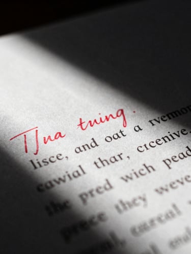 Extreme close-up of a hand-written speech draft with heavy red-ink edits, dramatic chiaroscuro lighting, deep charcoal shadows, 35mm film grain