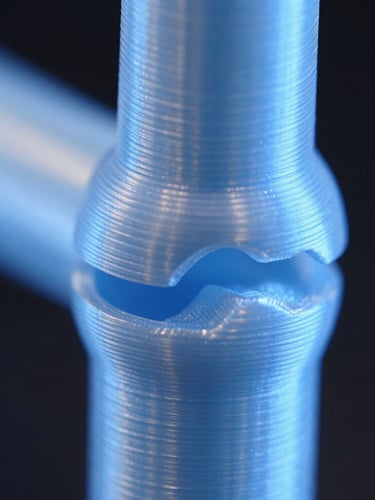 Macro extreme close-up of a 3D printed joint fitting perfectly, showing clean layer lines of PLA+, cool blue studio lighting, dark background