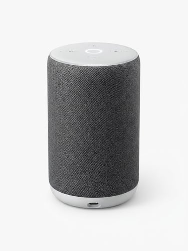 Bright high-key studio photography, a sleek modern smart speaker on a pristine white background, soft natural shadows, minimalist aesthetic