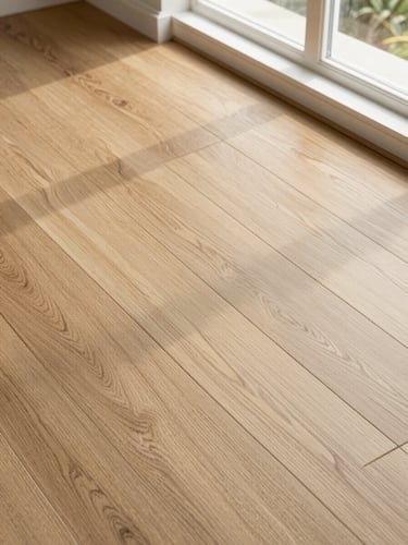Overhead detail shot of interlocking luxury vinyl planks with natural oak grain texture, bright Southern California window light, sharp detail, 35mm lens
