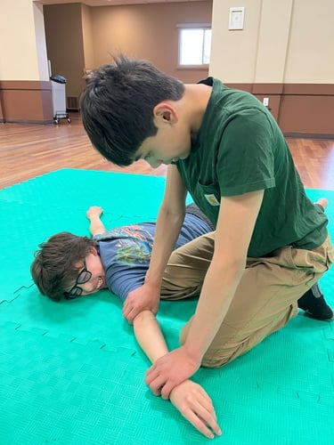 Beginner Kids practicing aikido's Ikkyo technique at the MPCA Hall