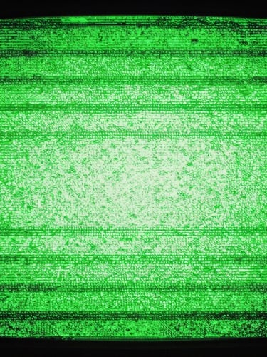 Glitchy analog screen static with high-contrast green neon glow, rough photocopy texture, 35mm grain