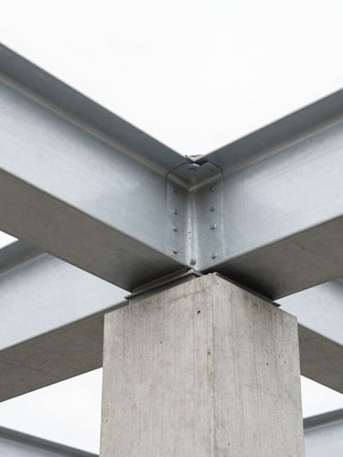 Abstract close-up of high-quality concrete textures and steel beams, bright natural overcast daylight, clean architectural photography