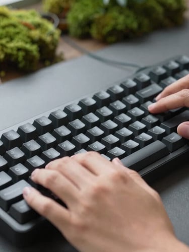 A close-up of hands adjusting a premium mechanical keyboard on a matte charcoal desk, surrounded by potted moss and soft, diffused daylight, shallow depth of field, 35mm.