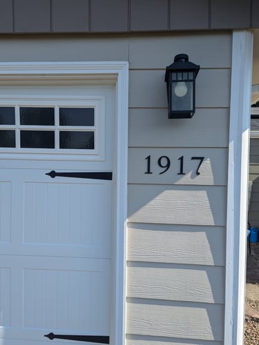 a house with a white door and a black door