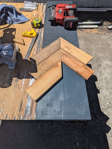 a piece of wood with chevron pattern starting on it.