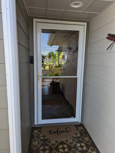 front porch with welcome mat