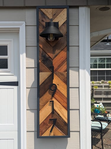 House address sign in a chevron pattern