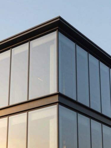 Modern structural glass facade corner joint, close-up architectural detail, steel frame, crisp reflections of golden hour sun, 35mm lens, minimalist composition