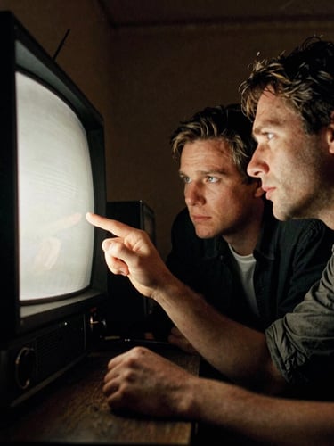 Dynamic low angle, high-contrast cinematic lighting on a gritty television set in motion, directors looking at a monitor under warm tungsten glow, 35mm grain.