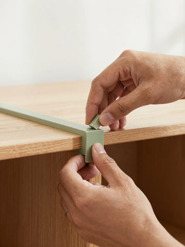 Close-up of craftsman hands carefully restoring a vintage cabinet joint, soft morning light, warm wood tones, clean minimalist setting, 35mm.