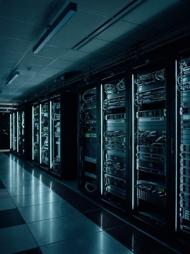 Sleek corporate server room with cool low-key studio lighting, deep navy and teal accents, sharp focus, architectural framing, 35mm