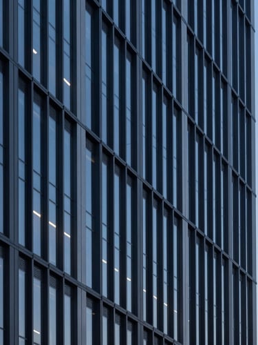 Architectural lines of a modern corporate office building facade at blue hour, cool tones, sharp focus, 35mm