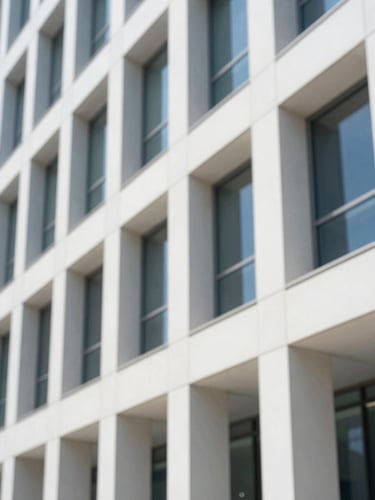 Architectural detail of a modern office building interior, clean lines, natural light, 35mm, bright natural daylight, shallow depth of field