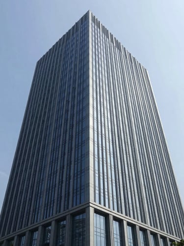 Modern glass skyscraper corporate headquarters in Jakarta, clean architectural lines, bright daylight with soft blue sky, professional corporate aesthetic