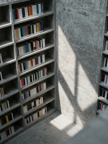 A high-angle architectural shot of a modern minimalist archive, structural lines of concrete bookshelves casting geometric shadows, cool diffused light.