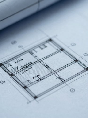 Macro close-up of a technical architectural blueprint with precise structural lines, cool frosted slate blue tint, diffused daylight.