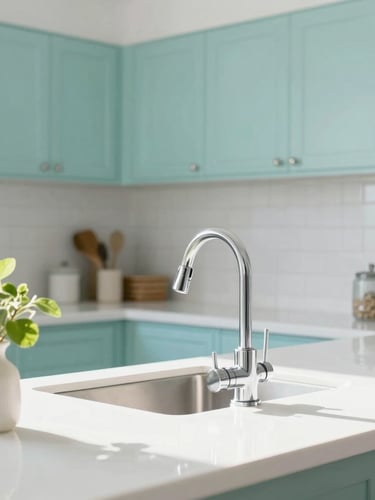 A vertical portrait of a beautifully organized kitchen, sunlit white countertops, a gleaming chrome faucet, and a small vase with fresh green leaves on the side.