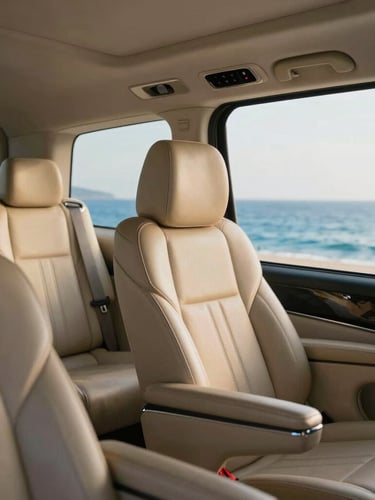 Close-up of a spotless modern Mercedes executive van interior, premium leather seating, bright soft coastal light pouring through the window, 35mm.
