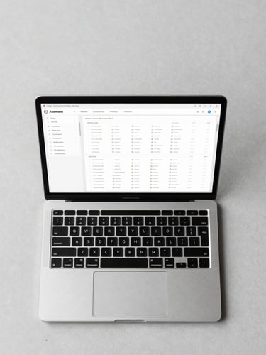 Overhead desk layout with a modern laptop showing a clean data dashboard, structured wireframes, neutral cool daylight, high contrast.