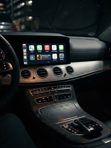 Premium automotive photography, close-up of a luxury car dashboard with integrated screen displaying CarPlay interface, dramatic cabin lighting, sharp details, dark background, 35mm