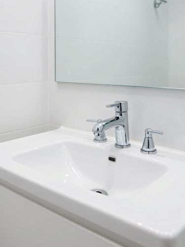 Wide shot of an immaculate, gleaming white Dubai bathroom post-service, high-key daylight reflecting off polished chrome fixtures, sharp focus