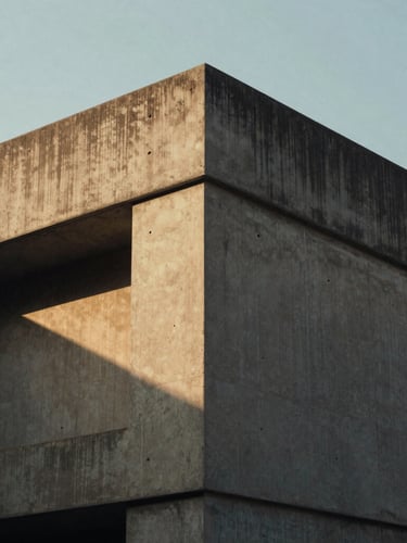 Close-up of modern concrete architectural angles in Hyderabad, soft golden-hour natural light, deep high-contrast shadows, 35mm film feel.