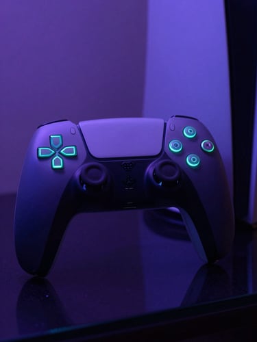 Close-up of a custom matte-black PlayStation 5 controller with glowing neon cyan LEDs resting on a dark reflective glass surface, moody low-key ambient lighting, purple undertones.