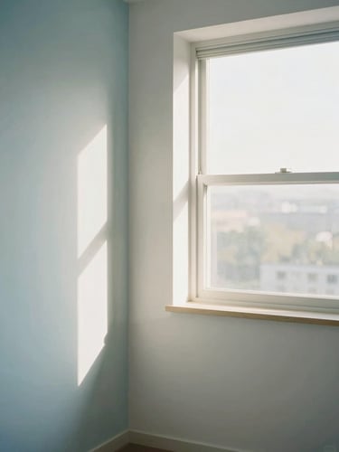 Light-filled architectural interior showing distinct zones of a home, soft morning window light, pale blue and warm white tones, clean minimalist composition, 35mm lens