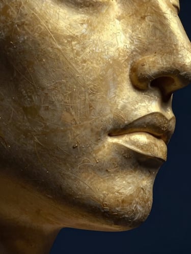 Macro editorial close-up of sculpted facial muscle contours, dramatic low-key studio lighting with sharp gold highlights, deep navy background, elegant and clinical aesthetic