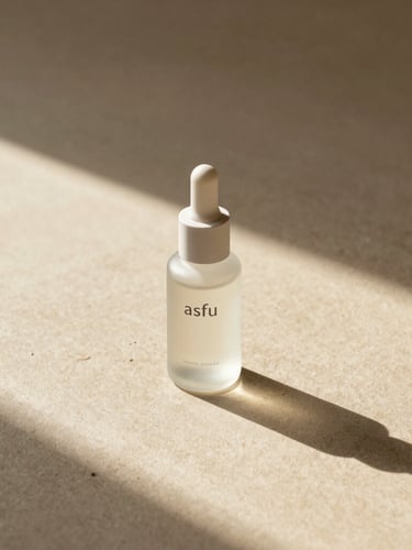 A single frosted glass bottle of asfu skincare casting a long, soft architectural shadow on a raw oatmeal-colored surface, warm morning light, negative space, wide panoramic composition.