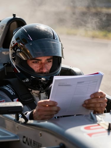 Close-up of a rally co-driver holding a pace note book, intense focus, inside a racing cockpit, high-contrast natural light, 35mm lens